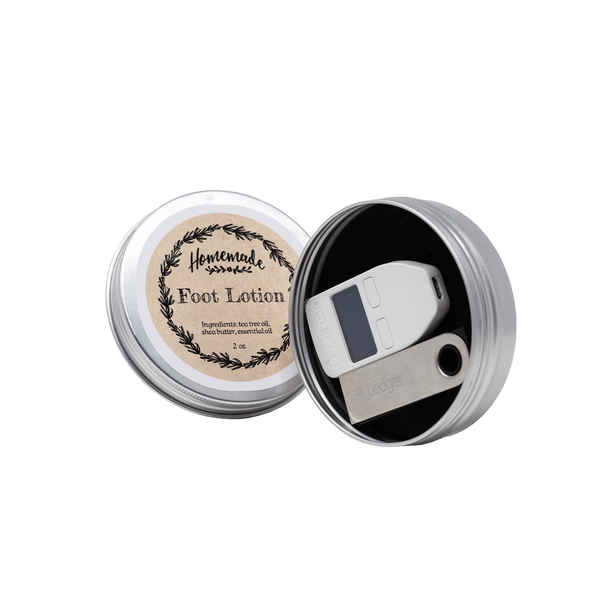 Ledger hardware wallet and steel recovery plate stored discreetly in a compact tin for secure seed storage